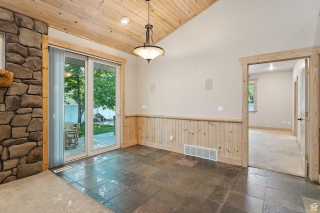 280 N Mill Rd, Heber City, UT 84032 - spare room featuring wooden ceiling, stone tile flooring, a wainscoted wall, vaulted ceiling, and baseboards
