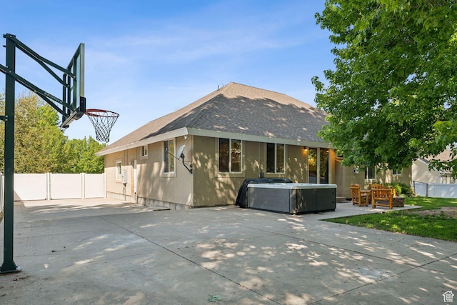 280 N Mill Rd, Heber City, UT 84032 - rear view of house with a hot tub, a shingled roof, and a patio area