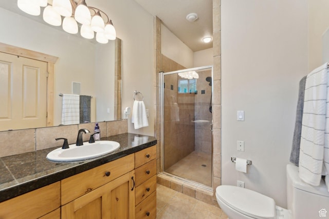 280 N Mill Rd, Heber City, UT 84032 - full bathroom with toilet, vanity, a shower stall, tile patterned floors, and backsplash