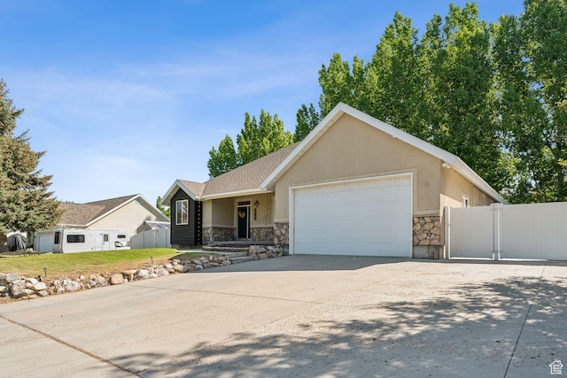280 N Mill Rd, Heber City, UT 84032 - ranch-style house featuring stone siding, a garage, a gate, driveway, and stucco siding