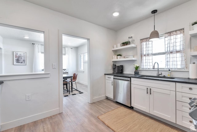 292 S 100 W, Provo, UT 84601 - kitchen with dishwasher, a sink, open shelves, dark countertops, and light wood-type flooring