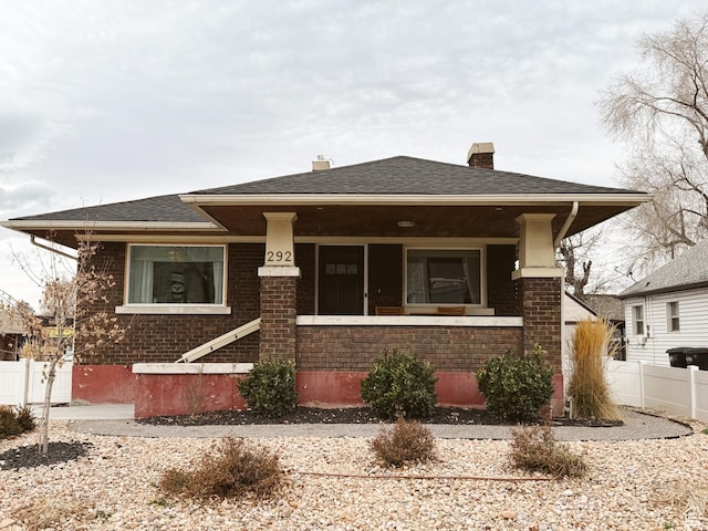 292 S 100 W, Provo, UT 84601 - view of front of home with brick siding, a chimney, and roof with shingles