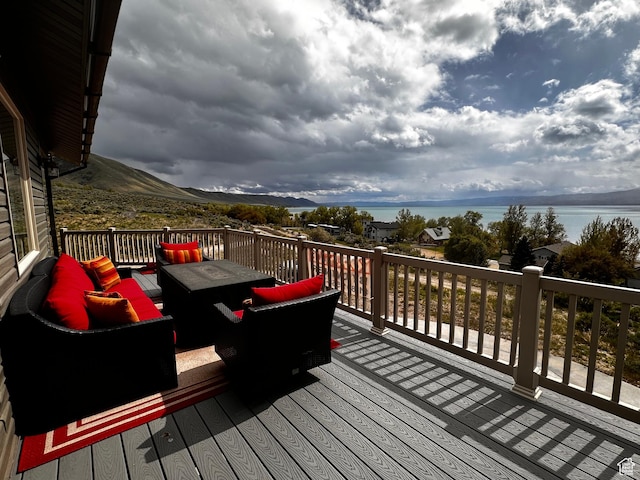 1940 E Shore Rd, Saint Charles, ID 83272 - wooden terrace featuring an outdoor hangout area and a water view