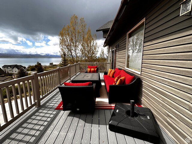 1940 E Shore Rd, Saint Charles, ID 83272 - deck featuring a water view and an outdoor living space
