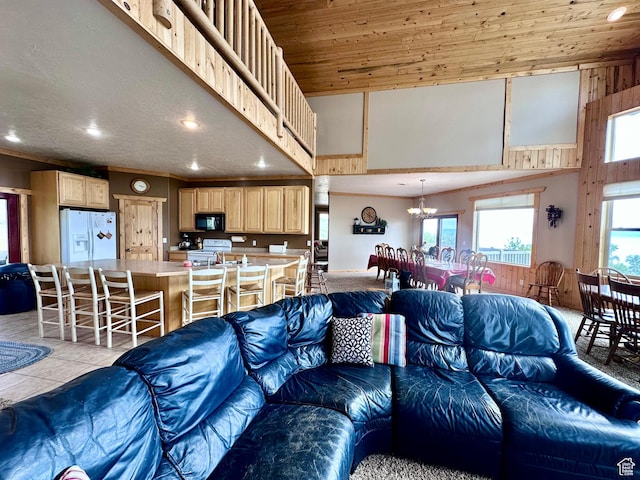 1940 E Shore Rd, Saint Charles, ID 83272 - living area featuring recessed lighting, a chandelier, a towering ceiling, and light tile patterned flooring