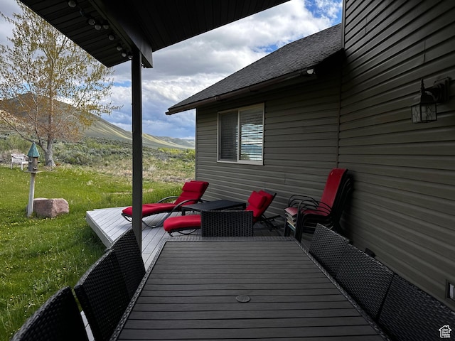 1940 E Shore Rd, Saint Charles, ID 83272 - wooden deck with a lawn and a mountain view