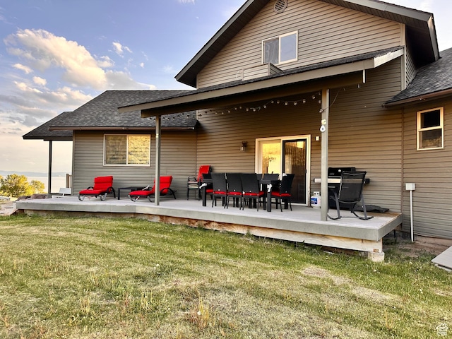 1940 E Shore Rd, Saint Charles, ID 83272 - back of house with a lawn, a shingled roof, and a wooden deck