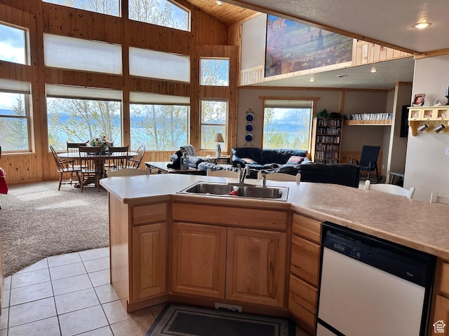 1940 E Shore Rd, Saint Charles, ID 83272 - kitchen featuring white dishwasher, a sink, light countertops, open floor plan, and high vaulted ceiling
