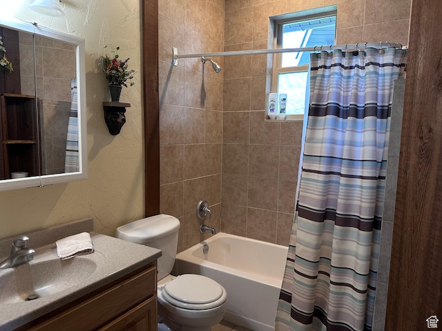 1940 E Shore Rd, Saint Charles, ID 83272 - bathroom with toilet, vanity, shower / bath combo with shower curtain, and a textured wall