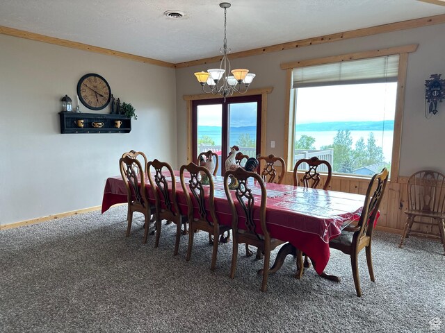 1940 E Shore Rd, Saint Charles, ID 83272 - carpeted dining room with a chandelier and healthy amount of natural light