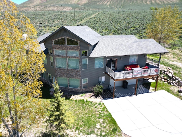 1940 E Shore Rd, Saint Charles, ID 83272 - back of property with a shingled roof and a mountain view