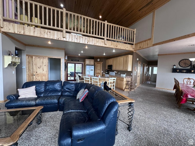 1940 E Shore Rd, Saint Charles, ID 83272 - living room featuring high vaulted ceiling, carpet floors, recessed lighting, baseboards, and crown molding
