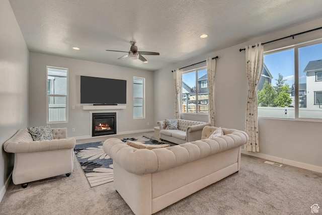 5058 W Blythswood Ln S, Herriman, UT 84096 - living room with plenty of natural light, baseboards, ceiling fan, recessed lighting, and a textured ceiling