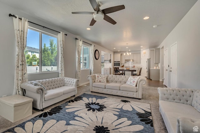 5058 W Blythswood Ln S, Herriman, UT 84096 - living area with recessed lighting, a chandelier, ceiling fan, and baseboards