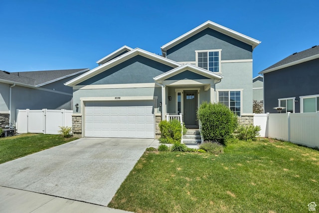 5058 W Blythswood Ln S, Herriman, UT 84096 - view of front of house with stucco siding, a garage, stone siding, and driveway