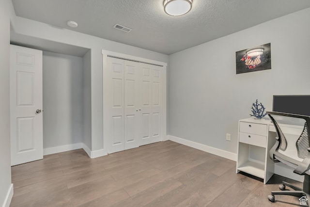 5058 W Blythswood Ln S, Herriman, UT 84096 - office space featuring wood finished floors, baseboards, and a textured ceiling