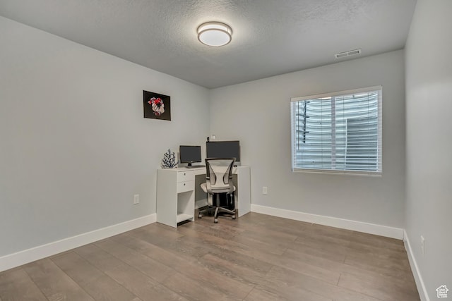 5058 W Blythswood Ln S, Herriman, UT 84096 - office space with a textured ceiling, wood finished floors, and baseboards