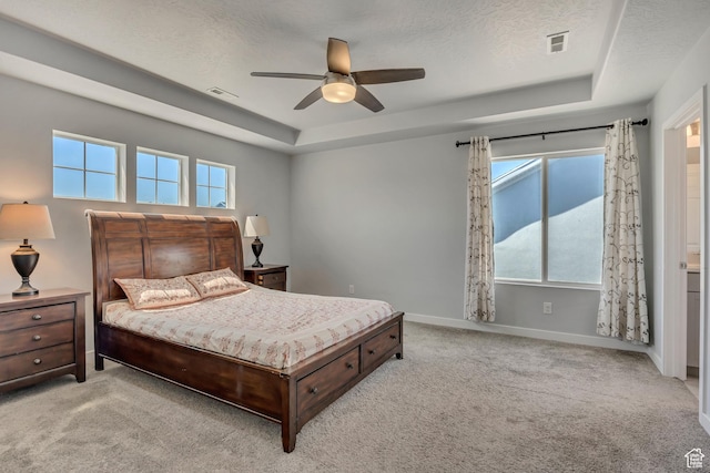 5058 W Blythswood Ln S, Herriman, UT 84096 - carpeted bedroom with a tray ceiling, multiple windows, a textured ceiling, baseboards, and ceiling fan