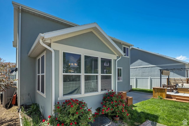 5058 W Blythswood Ln S, Herriman, UT 84096 - back of house with stucco siding and a patio