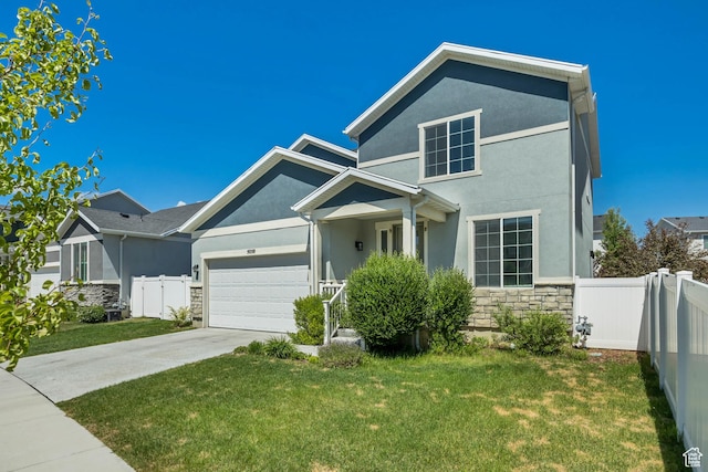 5058 W Blythswood Ln S, Herriman, UT 84096 - view of front of home with stone siding, stucco siding, an attached garage, and driveway
