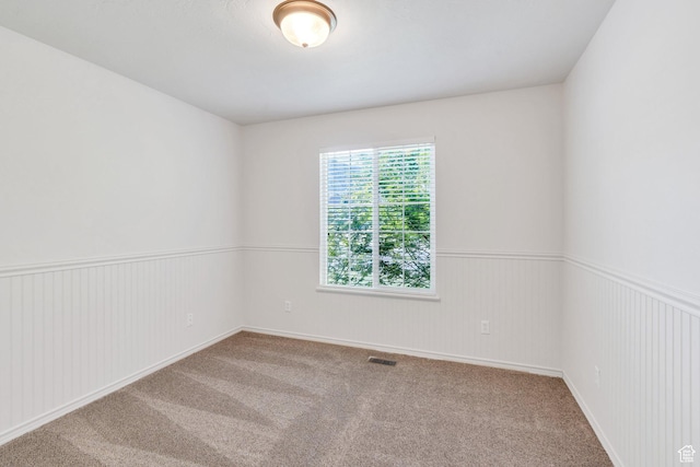 69 E Hudson Dr, Elk Ridge, UT 84651 - carpeted empty room featuring a wainscoted wall