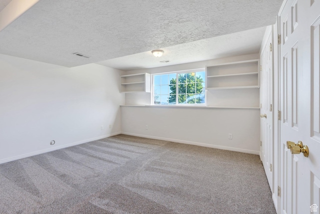 69 E Hudson Dr, Elk Ridge, UT 84651 - unfurnished bedroom featuring carpet floors, baseboards, and a textured ceiling
