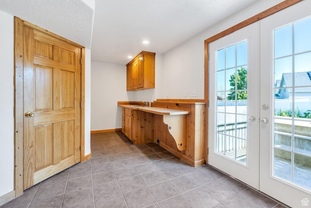 69 E Hudson Dr, Elk Ridge, UT 84651 - bar area with plenty of natural light, french doors, light tile patterned floors, and recessed lighting