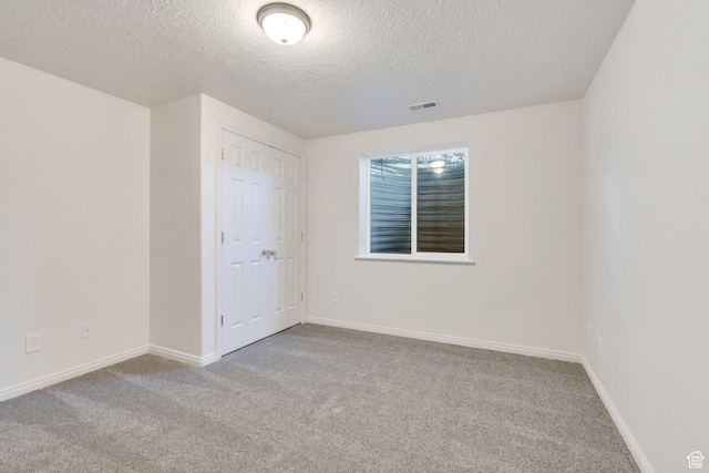69 E Hudson Dr, Elk Ridge, UT 84651 - unfurnished bedroom with carpet floors, a textured ceiling, and baseboards