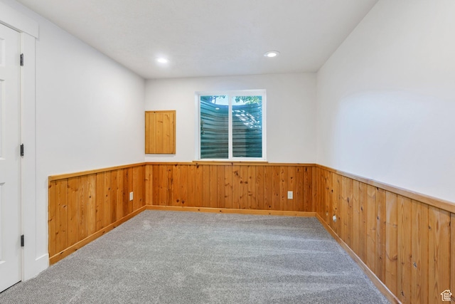 69 E Hudson Dr, Elk Ridge, UT 84651 - unfurnished room with a wainscoted wall, wood walls, carpet flooring, and recessed lighting