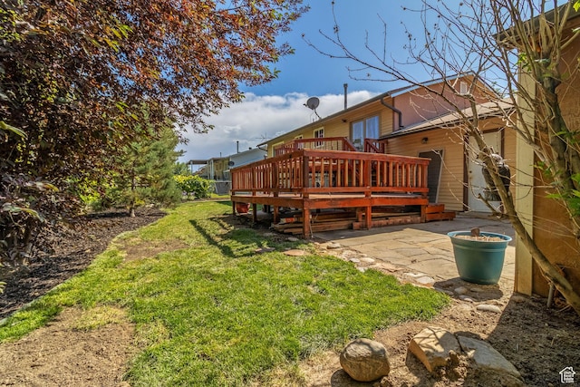628 N Sir Philip Dr, Salt Lake City, UT 84116 - view of grassy yard with a wooden deck and a patio area