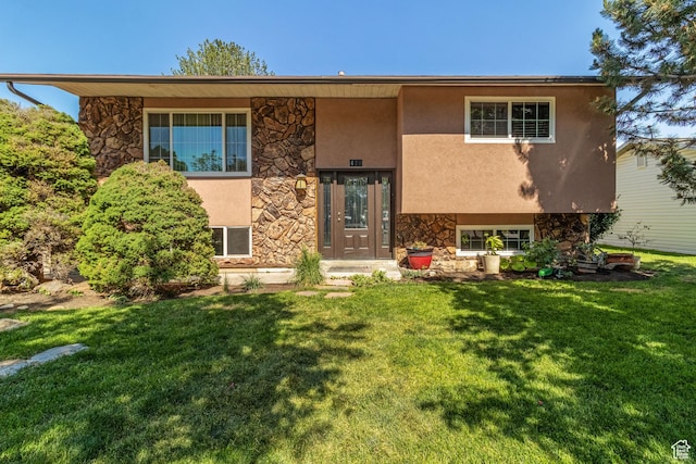 628 N Sir Philip Dr, Salt Lake City, UT 84116 - split foyer home featuring stone siding, stucco siding, and a front lawn
