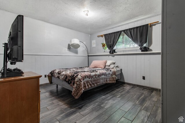 628 N Sir Philip Dr, Salt Lake City, UT 84116 - bedroom featuring a textured ceiling, wood finished floors, wainscoting, and wooden walls