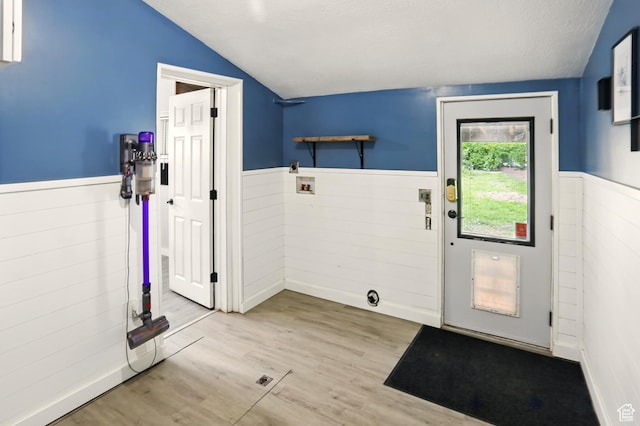 2411 S D Ave E, Ogden, UT 84401 - entryway featuring vaulted ceiling, a wainscoted wall, wood finished floors, and a textured ceiling