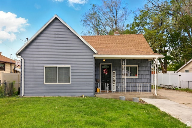 2411 S D Ave E, Ogden, UT 84401 - bungalow-style home featuring covered porch, a shingled roof, and a chimney