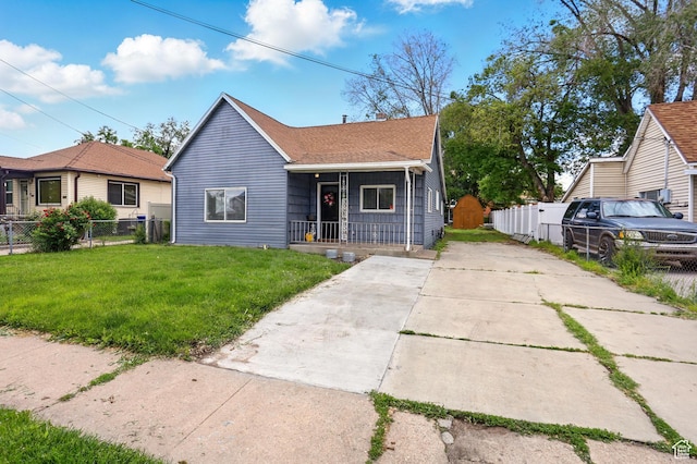 2411 S D Ave E, Ogden, UT 84401 - bungalow with covered porch, driveway, and a shingled roof