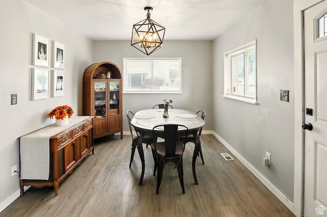 2411 S D Ave E, Ogden, UT 84401 - dining room featuring light wood-style flooring, plenty of natural light, and a chandelier