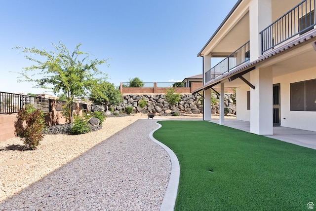 833 N Camino Pico, Washington, UT 84780 - fenced backyard featuring a balcony and a patio