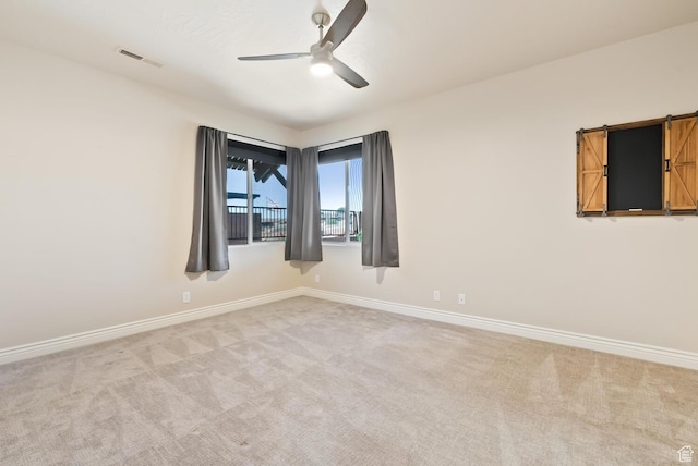 833 N Camino Pico, Washington, UT 84780 - spare room with ceiling fan, light carpet, and baseboards