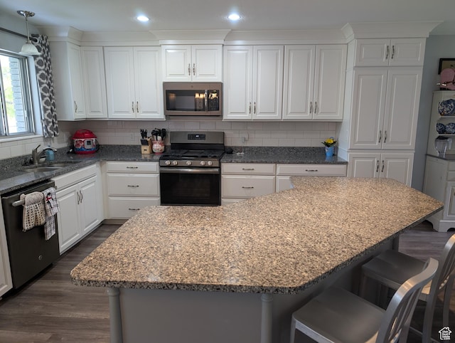 897 E 1200 N, Mapleton, UT 84664 - kitchen with appliances with stainless steel finishes, a sink, white cabinetry, decorative backsplash, and recessed lighting