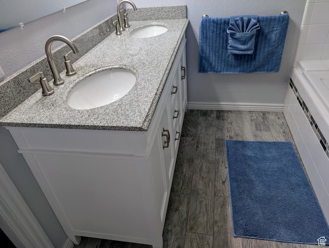 897 E 1200 N, Mapleton, UT 84664 - full bathroom with double vanity, wood finished floors, and tiled bath