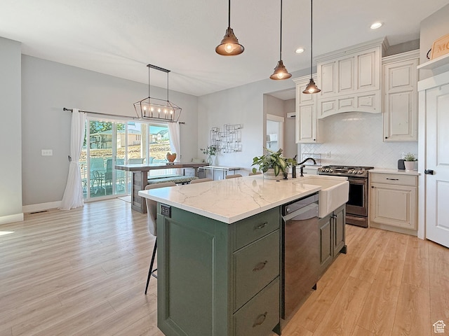 3723 N 500 E, North Ogden, UT 84414 - kitchen with dishwashing machine, gas stove, decorative backsplash, light wood finished floors, and recessed lighting