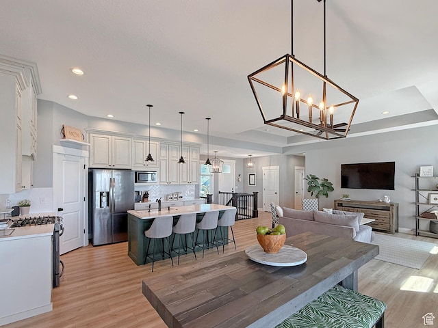 3723 N 500 E, North Ogden, UT 84414 - dining area with a chandelier, light wood-style flooring, recessed lighting, and baseboards
