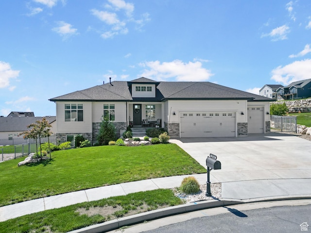 3723 N 500 E, North Ogden, UT 84414 - prairie-style house with stone siding, an attached garage, and concrete driveway