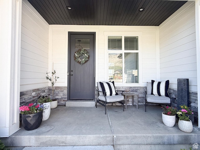 3723 N 500 E, North Ogden, UT 84414 - view of exterior entry with a porch and stone siding
