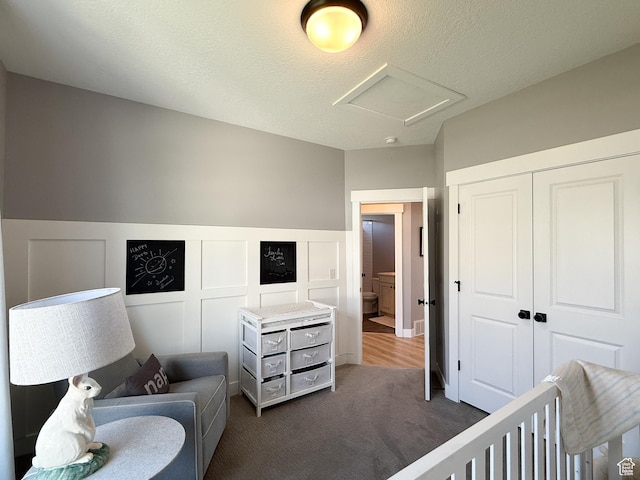 3723 N 500 E, North Ogden, UT 84414 - bedroom with carpet flooring, attic access, a closet, a wainscoted wall, and a decorative wall