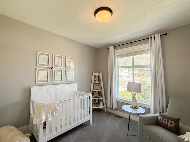 3723 N 500 E, North Ogden, UT 84414 - bedroom featuring carpet, baseboards, a crib, and a textured ceiling
