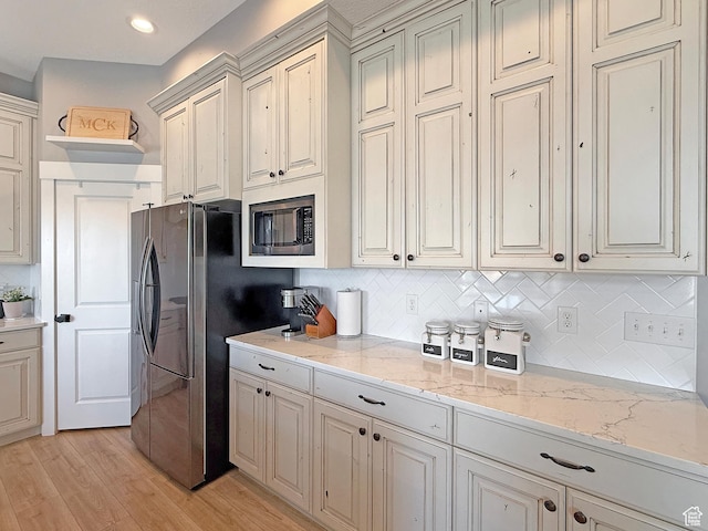 3723 N 500 E, North Ogden, UT 84414 - kitchen featuring built in microwave, freestanding refrigerator, light wood-type flooring, backsplash, and recessed lighting