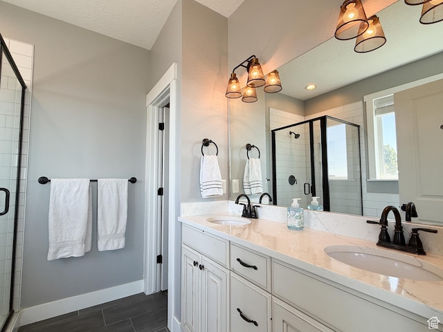 3723 N 500 E, North Ogden, UT 84414 - full bath featuring a shower stall, double vanity, and baseboards