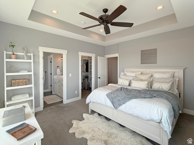 3723 N 500 E, North Ogden, UT 84414 - carpeted bedroom featuring a raised ceiling, a spacious closet, baseboards, recessed lighting, and ensuite bathroom