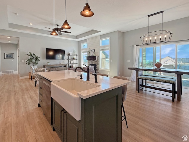 3723 N 500 E, North Ogden, UT 84414 - kitchen with a sink, a raised ceiling, open floor plan, a ceiling fan, and pendant lighting